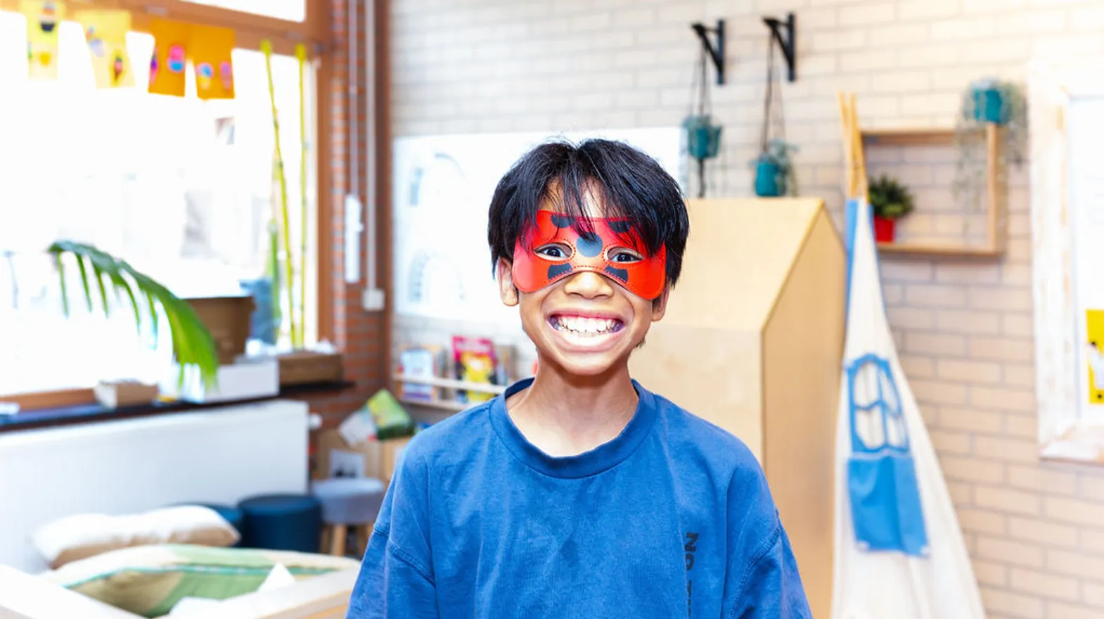 Lachend kindje van BSO Hartendief in Utrecht Kind&co ludens