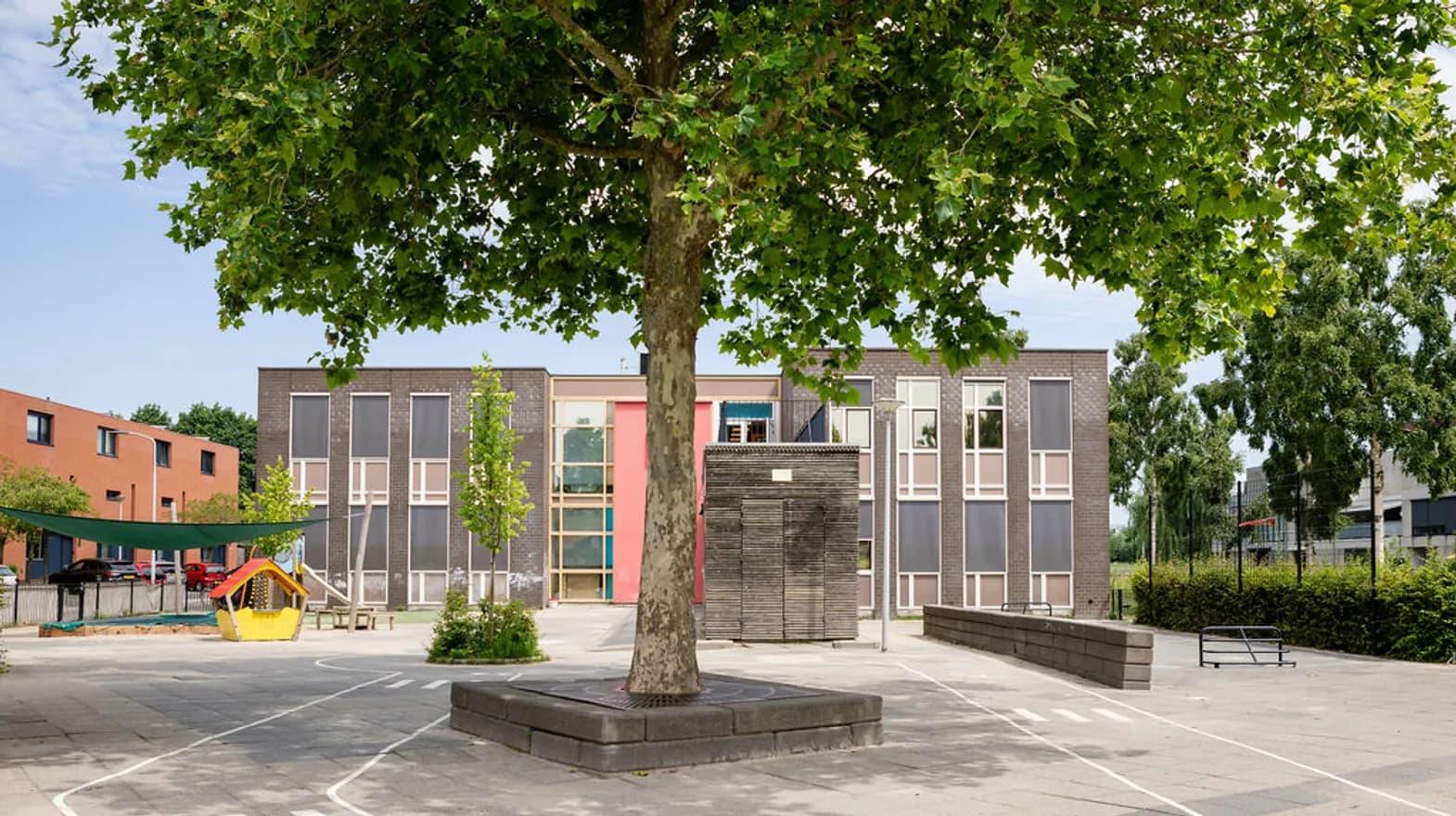 Buitenruimte van BSO Schoolwoningen, Kind&co ludens