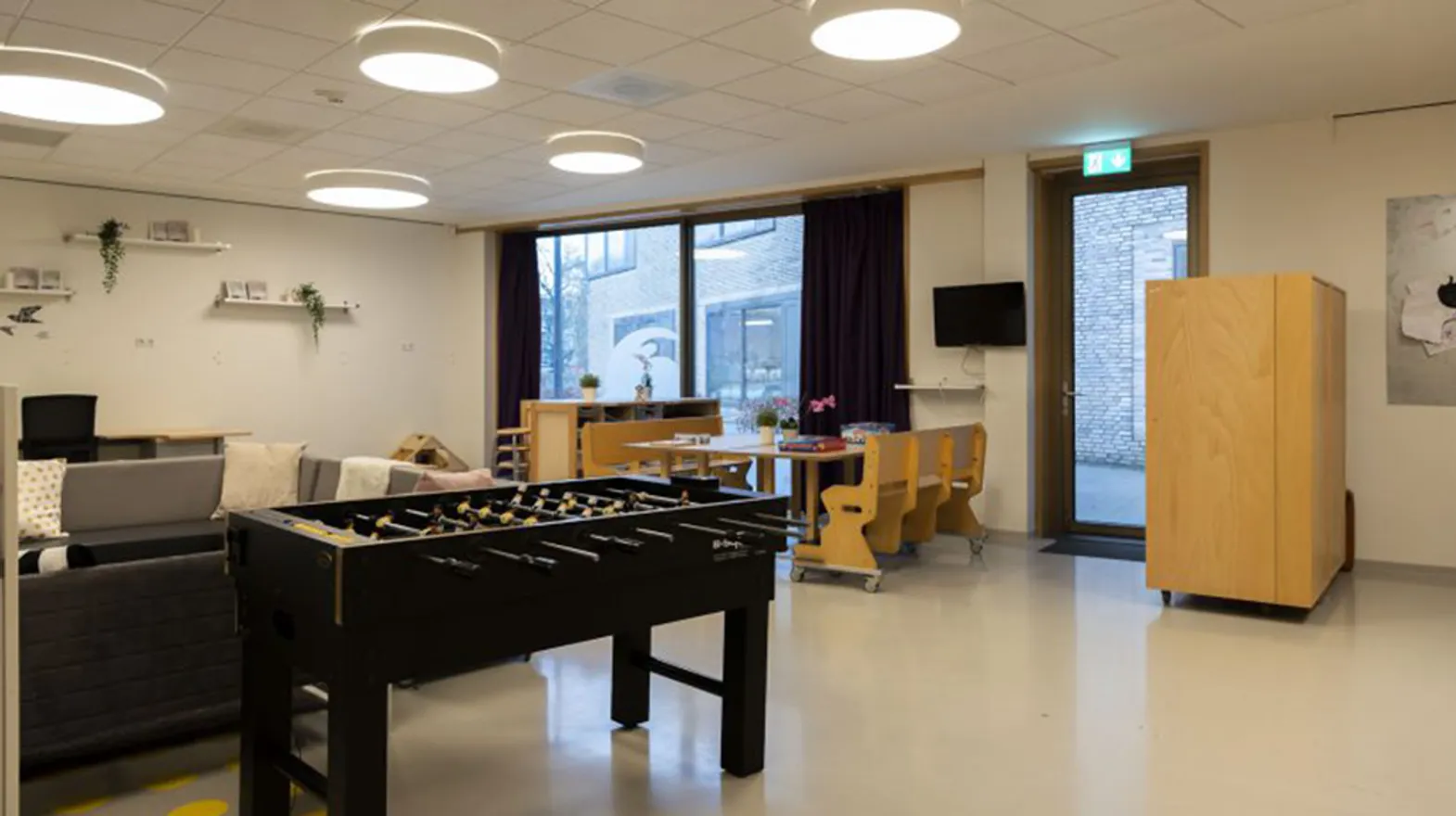 De groepsruimte met een tafelvoetbalspel bij BSO Steenarend Bilthoven van kinderopvang Kind&co ludens