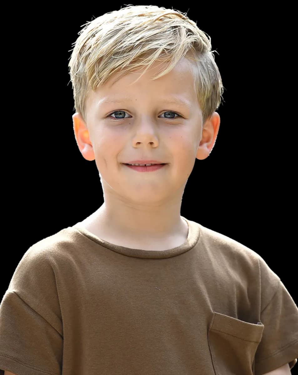 Kind poseert blij bij kinderopvang Kind&co ludens